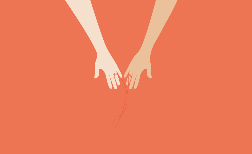 Image of two hands side by side, with a piece of red string tied to each ring finger.