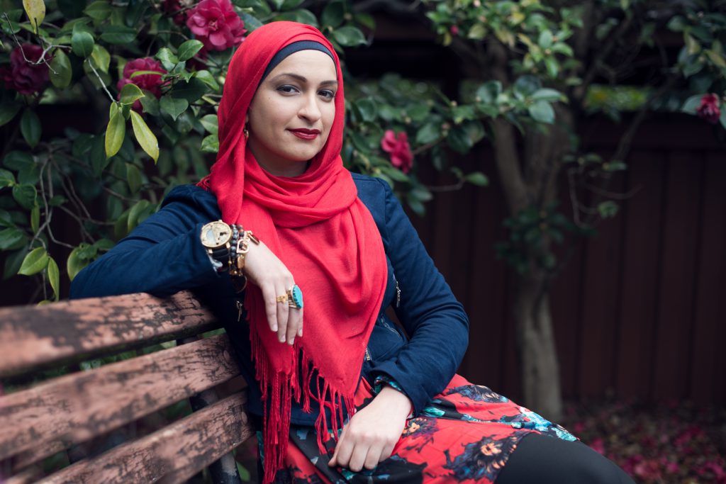 Photo of a Maryam sitting on a park bench