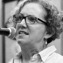 A black and white image of Josephine speaking into a microphone