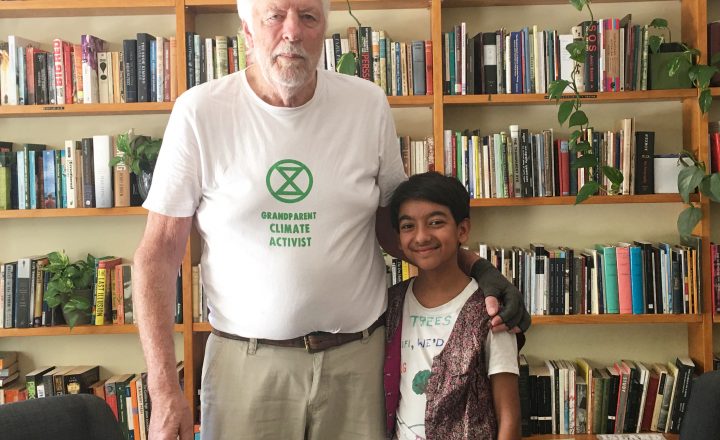 Photo of Les Harrison and Reuben Saggar standing in front of the bookshelves at the Centre for Stories